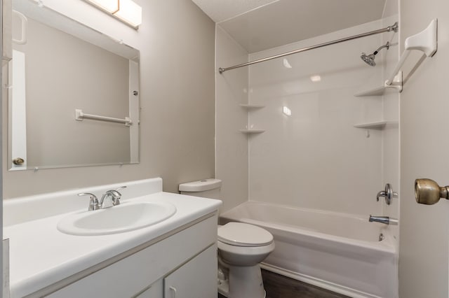 bathroom with shower / bathtub combination, toilet, and vanity