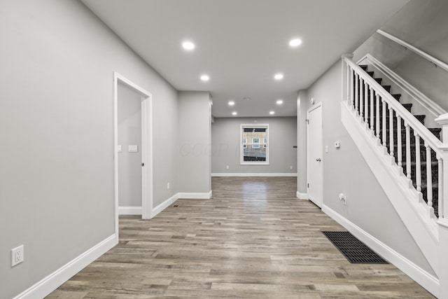 interior space with visible vents, recessed lighting, light wood-style floors, and baseboards