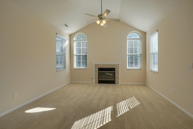 unfurnished living room featuring visible vents, a fireplace, baseboards, and light carpet