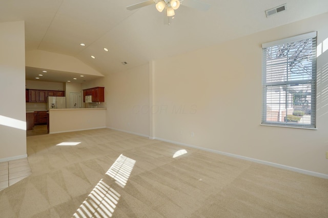 unfurnished living room with recessed lighting, baseboards, and light carpet