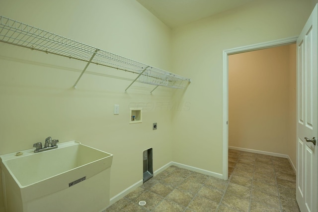 laundry room featuring hookup for a washing machine, baseboards, laundry area, electric dryer hookup, and a sink