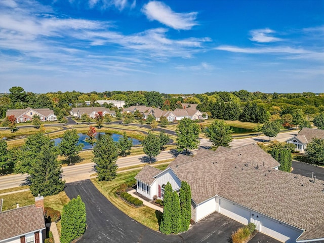 birds eye view of property with a residential view and a water view