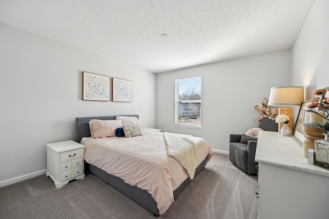 bedroom featuring carpet flooring, a textured ceiling, and baseboards