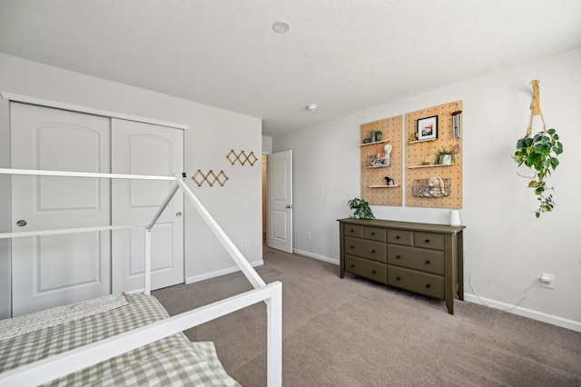 bedroom featuring carpet and baseboards