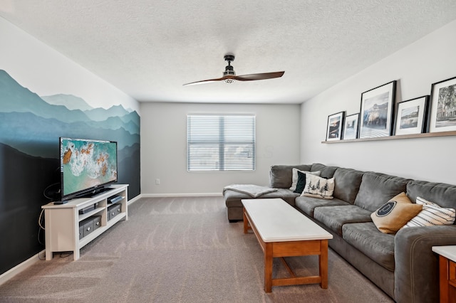 carpeted living room featuring a ceiling fan, baseboards, and a textured ceiling