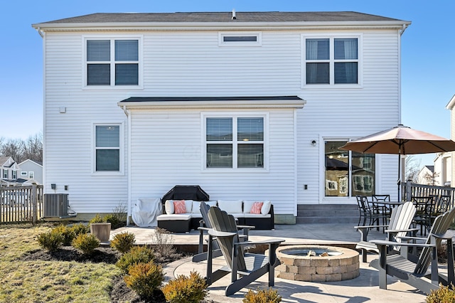 back of house with cooling unit, a patio, a fire pit, and fence