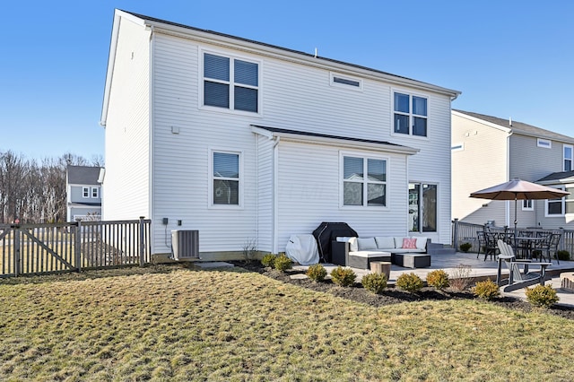 back of house with fence, an outdoor living space, a patio area, central air condition unit, and a lawn