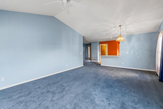 unfurnished living room with dark carpet, baseboards, a ceiling fan, and vaulted ceiling