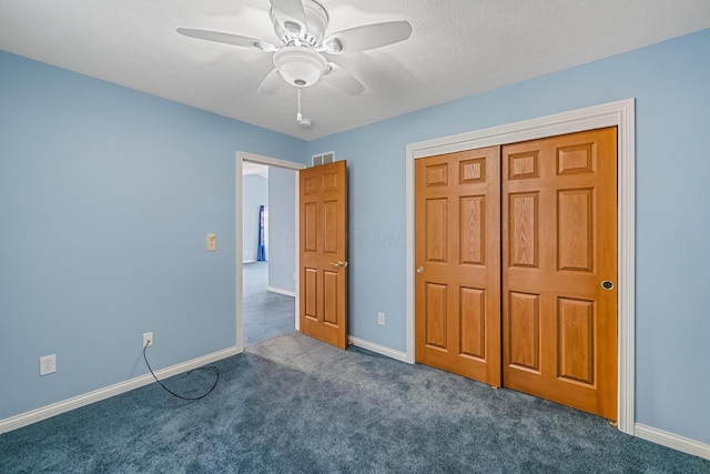 unfurnished bedroom featuring visible vents, baseboards, ceiling fan, carpet flooring, and a closet