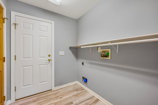 clothes washing area featuring washer hookup, light wood-style floors, baseboards, hookup for an electric dryer, and laundry area