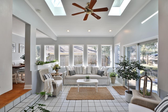 sunroom with lofted ceiling with skylight and ceiling fan