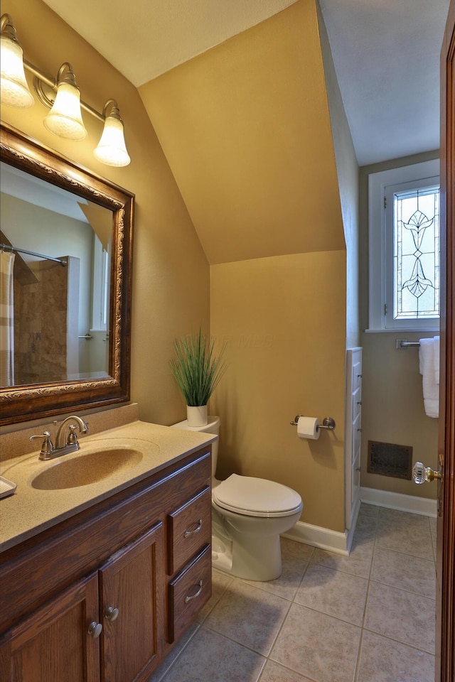 bathroom with vanity, visible vents, vaulted ceiling, tile patterned floors, and toilet