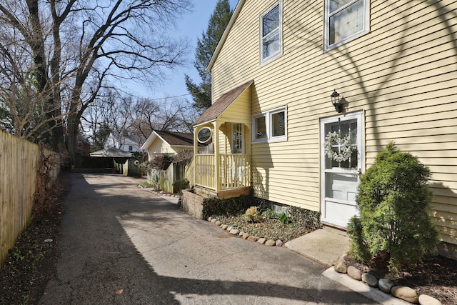 view of home's exterior featuring fence