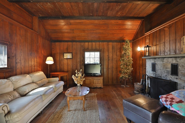 living area with wood ceiling, visible vents, vaulted ceiling with beams, and hardwood / wood-style floors