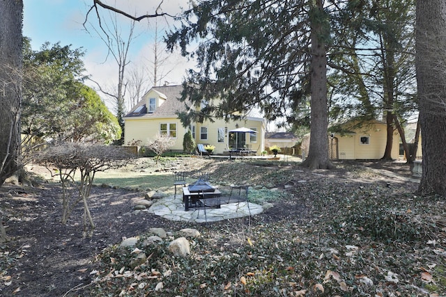 view of yard featuring a patio area and a fire pit