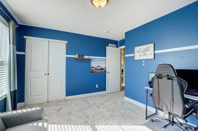 office area with visible vents, baseboards, and carpet floors