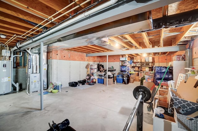 unfinished basement featuring water heater