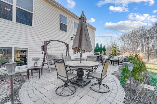 view of patio / terrace featuring outdoor dining space and an outdoor hangout area