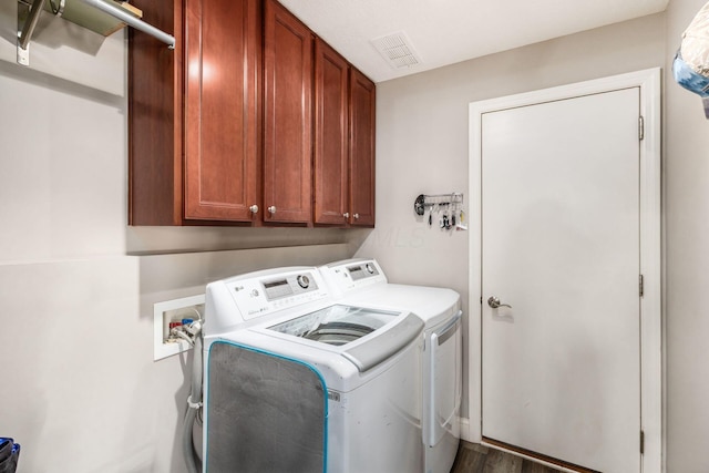 6148 Ryan Woods Way, Hilliard, OH 43026 - clothes washing area with cabinet space, visible vents, and independent washer and dryer
