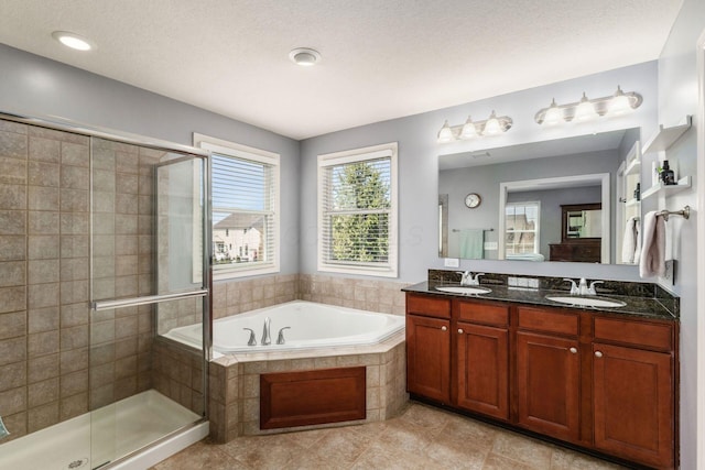 6148 Ryan Woods Way, Hilliard, OH 43026 - full bathroom featuring a shower stall, a garden tub, a sink, and double vanity