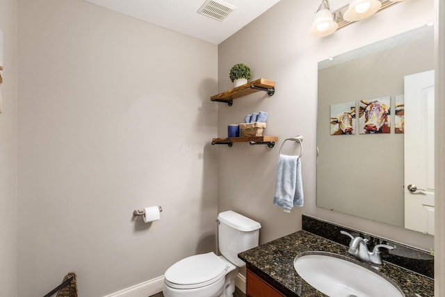 6148 Ryan Woods Way, Hilliard, OH 43026 - bathroom featuring toilet, vanity, visible vents, and baseboards