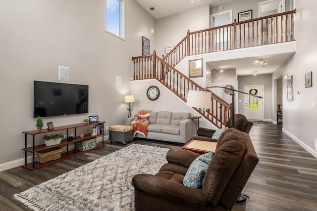 6148 Ryan Woods Way, Hilliard, OH 43026 - living area featuring stairway, a high ceiling, baseboards, and dark wood-style floors