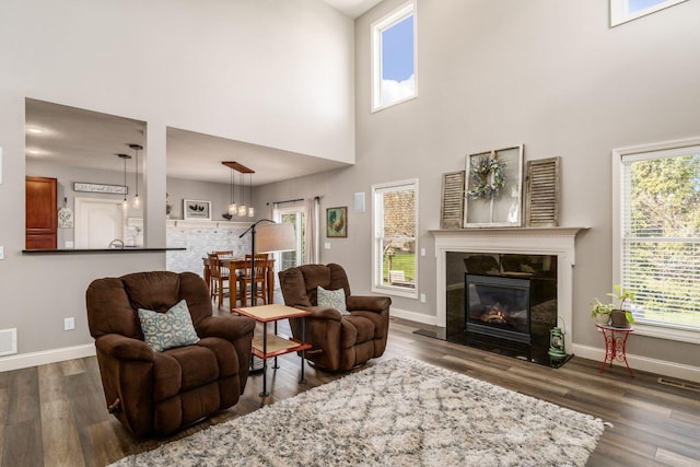 6148 Ryan Woods Way, Hilliard, OH 43026 - living area with baseboards, wood finished floors, and a high ceiling