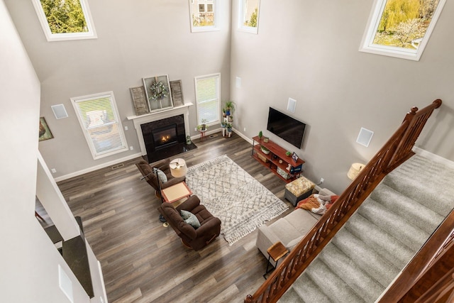 6148 Ryan Woods Way, Hilliard, OH 43026 - living area with stairway, a wealth of natural light, and wood finished floors