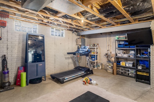 6148 Ryan Woods Way, Hilliard, OH 43026 - workout area featuring brick wall