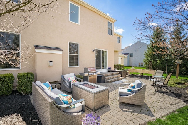 6148 Ryan Woods Way, Hilliard, OH 43026 - rear view of property featuring a patio area, an outdoor living space with a fire pit, and stucco siding