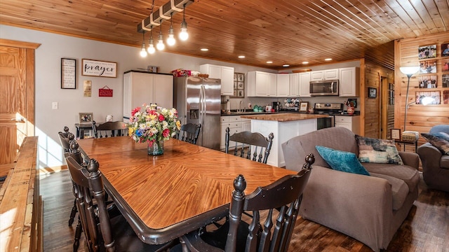 dining space with recessed lighting, wood ceiling, and dark wood-type flooring