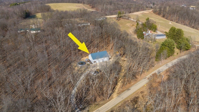 birds eye view of property featuring a rural view