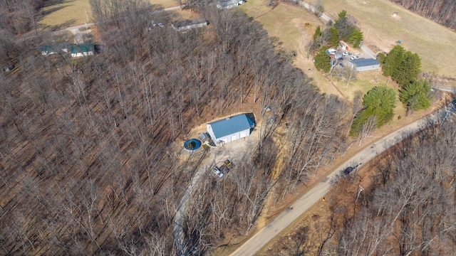 birds eye view of property with a rural view