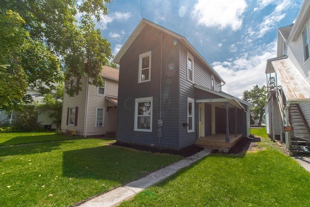 exterior space with covered porch and a yard