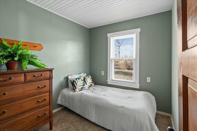 bedroom featuring baseboards and carpet floors