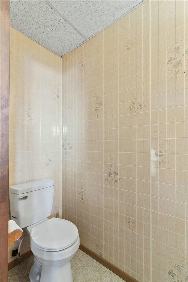 bathroom featuring tile patterned floors and toilet