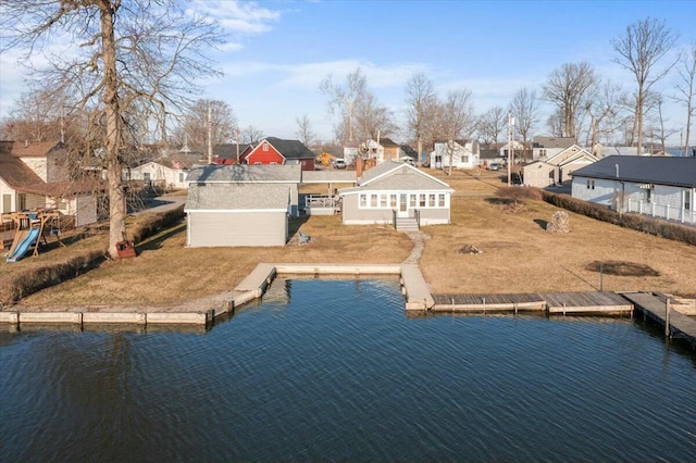 drone / aerial view with a residential view and a water view