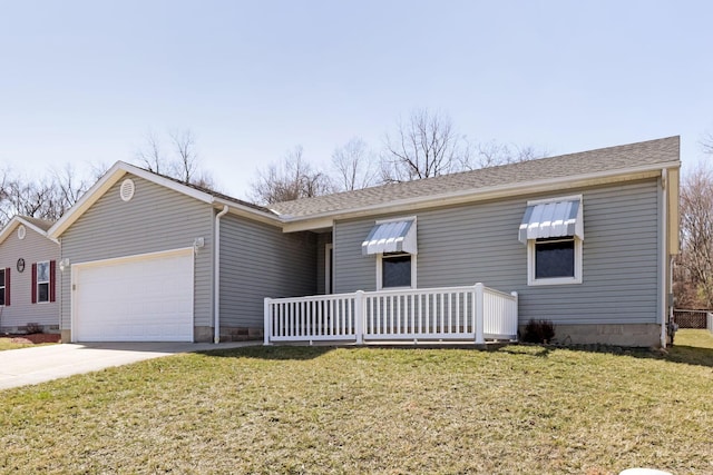 ranch-style home with an attached garage, concrete driveway, a front yard, and a shingled roof