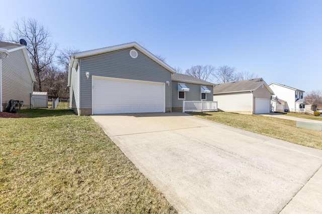 view of front facade with a garage, concrete driveway, and a front yard