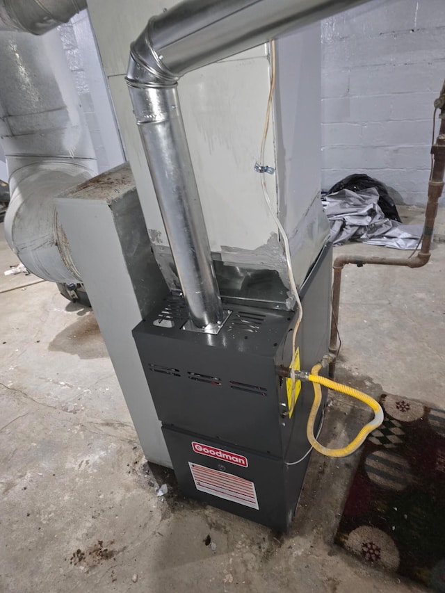 utility room featuring heating unit