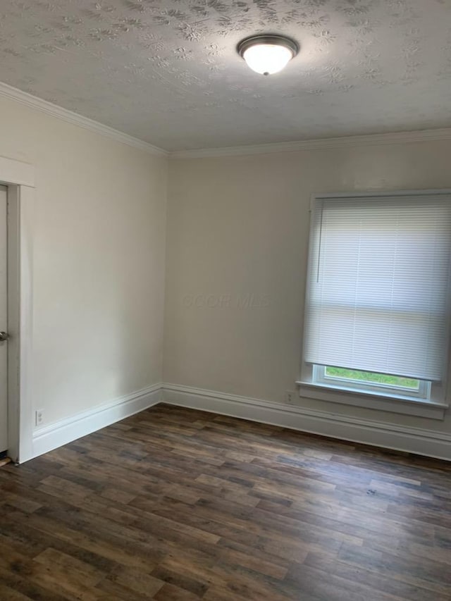 unfurnished room with a textured ceiling, dark wood finished floors, and crown molding