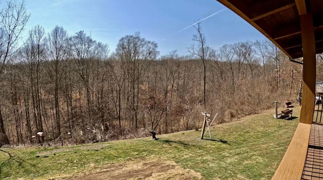 view of yard featuring a wooded view