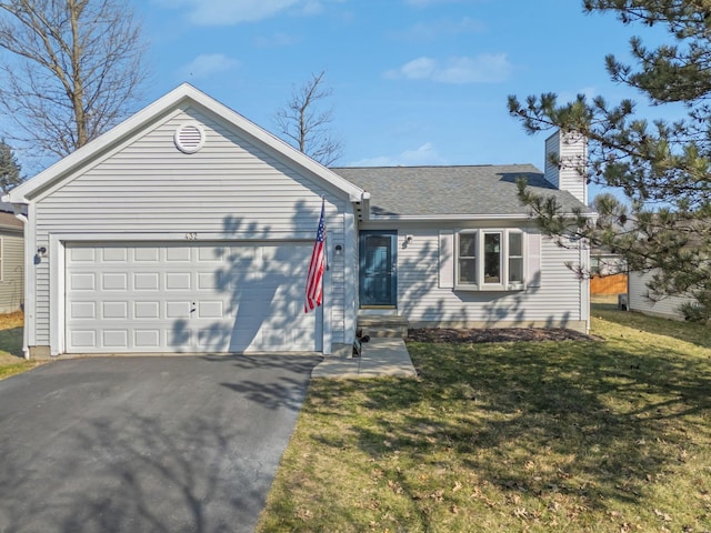 ranch-style home featuring a front yard, an attached garage, a shingled roof, a chimney, and aphalt driveway