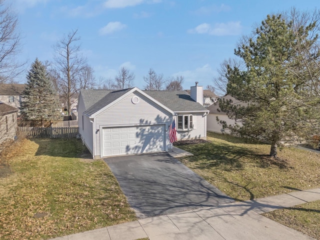 view of front of home featuring aphalt driveway, a garage, fence, and a front lawn