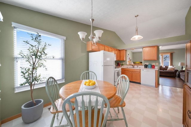 dining area with light floors, baseboards, vaulted ceiling, a textured ceiling, and a chandelier