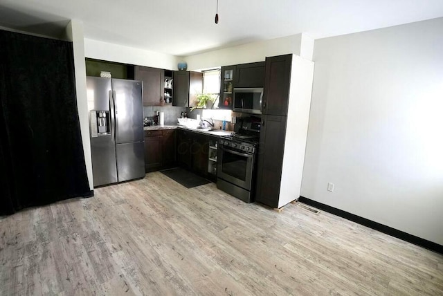 1664 Deporres Dr, Columbus, OH 43219 - kitchen featuring light wood-style floors, dark brown cabinetry, visible vents, and stainless steel appliances