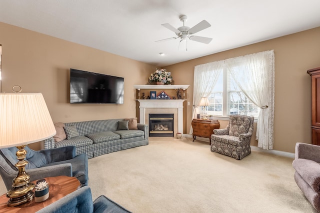 7677 Scioto Ridge Dr, Powell, OH 43065 - living area with light carpet, a glass covered fireplace, ceiling fan, and baseboards