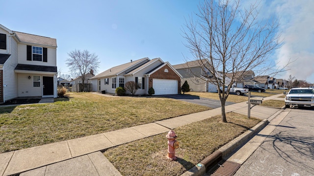 view of front facade with aphalt driveway, a residential view, an attached garage, and a front yard