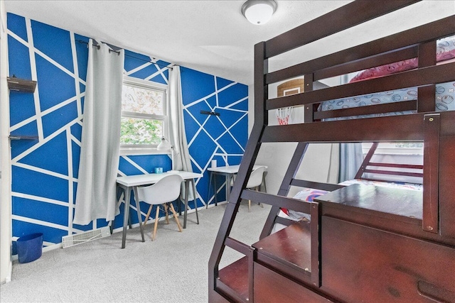 bedroom with visible vents and carpet floors