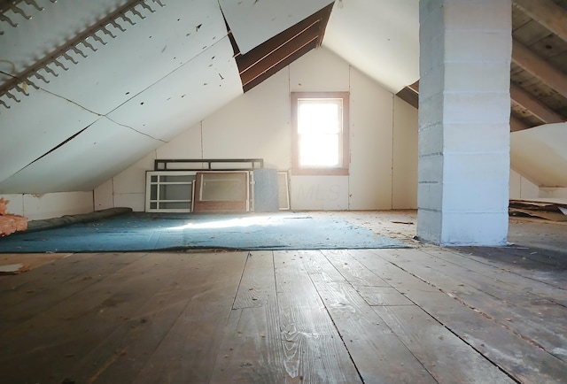 bonus room with lofted ceiling and wood-type flooring